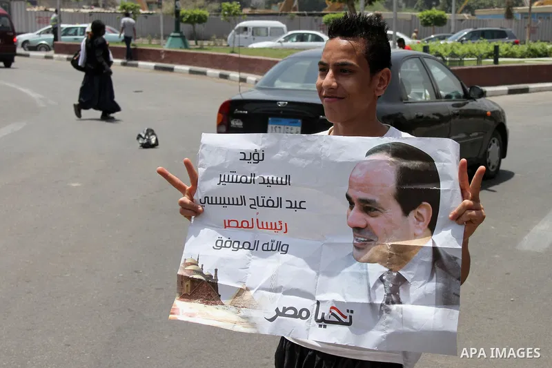 Egyptian supporters of Abdel Fattah al-Sisi celebrate at Tahrir square in Cairo May 29, 2014. Initial poll count on Wednesday showed that Egypt's former military chief Abdel Fattah al-Sisi would get a landslide victory i...