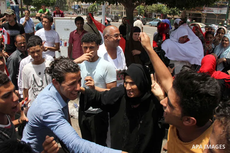 Egyptian supporters of Abdel Fattah al-Sisi celebrate at Tahrir square in Cairo May 29, 2014. Initial poll count on Wednesday showed that Egypt's former military chief Abdel Fattah al-Sisi would get a landslide victory i...