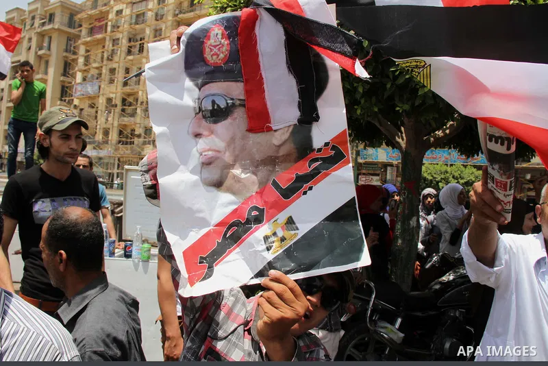 Egyptian supporters of Abdel Fattah al-Sisi celebrate at Tahrir square in Cairo May 29, 2014. Initial poll count on Wednesday showed that Egypt's former military chief Abdel Fattah al-Sisi would get a landslide victory i...