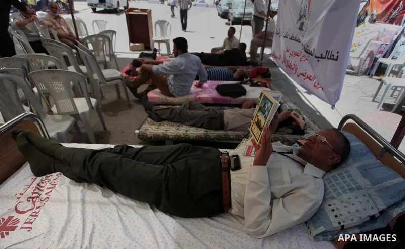 Relatives of hunger strike Palestinian prisoners of Israeli jails stay at a tent in front of Red cross office in Gaza City, to solidarity with Palestinian prisoners, on May 29, 2014. It was about 120 Palestinians impriso...