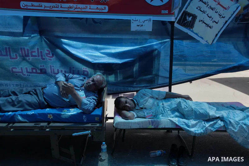 Relatives of hunger strike Palestinian prisoners of Israeli jails stay at a tent in front of Red cross office in Gaza City, to solidarity with Palestinian prisoners, on May 29, 2014. It was about 120 Palestinians impriso...