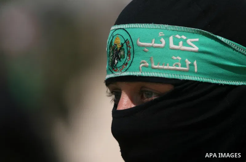 Palestinian militants of the Ezzedine al-Qassam Brigades, Hamas's armed wing, parade in Rafah, southern Gaza Strip, on May 29, 2014. Palestinian president Mahmud Abbas sent a "letter of designation" to Rami Hamdallah, wh...