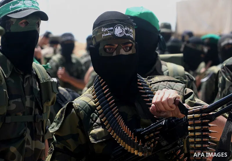 Palestinian militants of the Ezzedine al-Qassam Brigades, Hamas's armed wing, parade in Rafah, southern Gaza Strip, on May 29, 2014. Palestinian president Mahmud Abbas sent a "letter of designation" to Rami Hamdallah, wh...