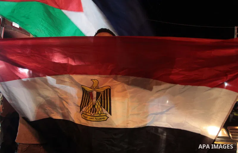 Palestinians celebrate in Gaza City on May 30, 2014, after Palestine qualified for their maiden Asian Cup appearance with a 1-0 win over injury-hit Philippines in the final of the AFC Challenge Cup in Maldives. Photo by...