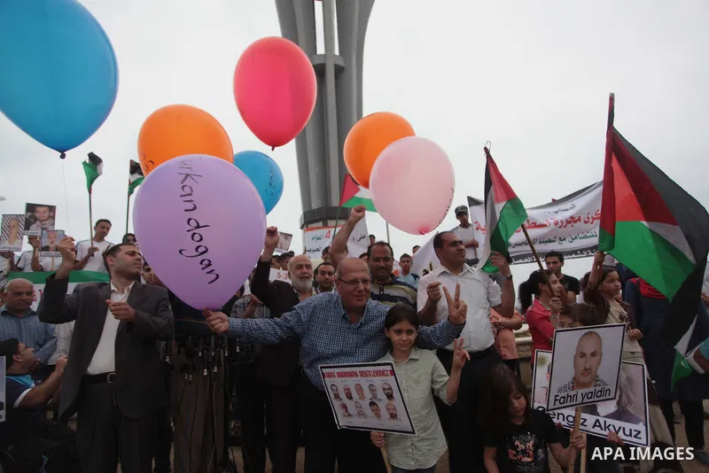 Palestinians hold balloons during a rally on the fourth anniversary of the Mavi Marmara Gaza flotilla incident, at the seaport of Gaza City May 31, 2014. Eight Turks and a Turkish-American, died in an Israeli commando ra...