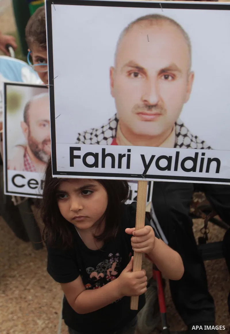 Palestinians take part a rally on the fourth anniversary of the Mavi Marmara Gaza flotilla incident, at the seaport of Gaza City May 31, 2014. Eight Turks and a Turkish-American, died in an Israeli commando raid on the M...