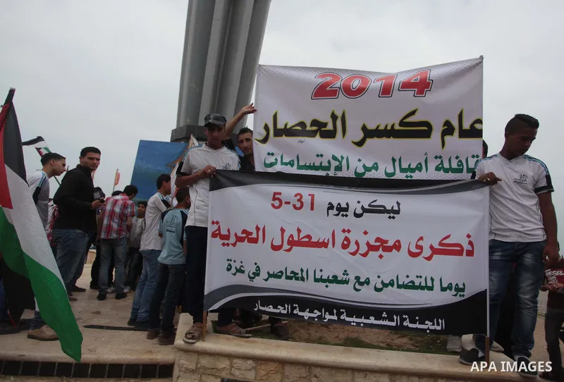 Palestinians take part a rally on the fourth anniversary of the Mavi Marmara Gaza flotilla incident, at the seaport of Gaza City May 31, 2014. Eight Turks and a Turkish-American, died in an Israeli commando raid on the M...