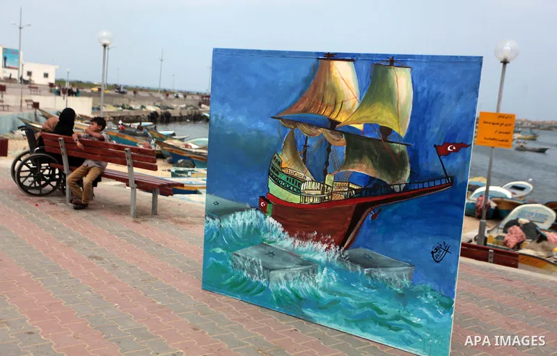 A Palestinian sits during a rally on the fourth anniversary of the Mavi Marmara Gaza flotilla incident, at the seaport of Gaza City May 31, 2014. Eight Turks and a Turkish-American, died in an Israeli commando raid on th...