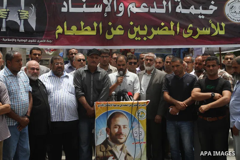 Palestinians speak a press conference at a tent in front of Red cross office in Gaza City, to solidarity with Palestinian prisoners, on May 31, 2014. It was about 120 Palestinians imprisoned without trial in Israel on an...