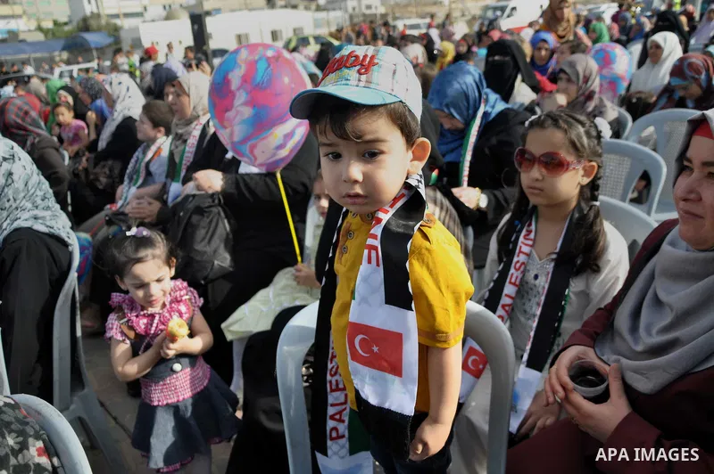 Palestinians take part a celebrate to mark the fourth anniversary of the Mavi Marmara Gaza flotilla incident, organized by the Turkish humanitarian relief IHH, at the seaport of Gaza City May 31, 2014. Eight Turks and a...