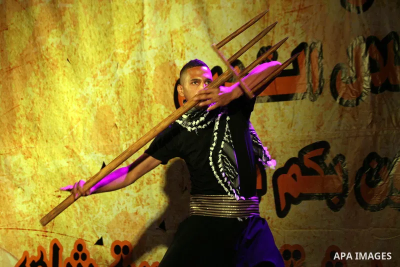Palestinian youths participate in a festival "Manqusha and tea cup" for the Arts and Heritage, in Jerusalem old city, on May 31, 2014. Photo by Saeed Qaq