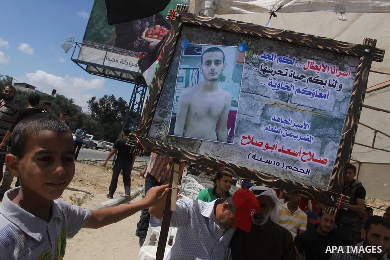Palestinians take part a protest to solidarity with Palestinian prisoners, at a tent near Erez crossing in the northern Gaza Strip on June 01, 2014. It was about 120 Palestinians imprisoned without trial in Israel on an...