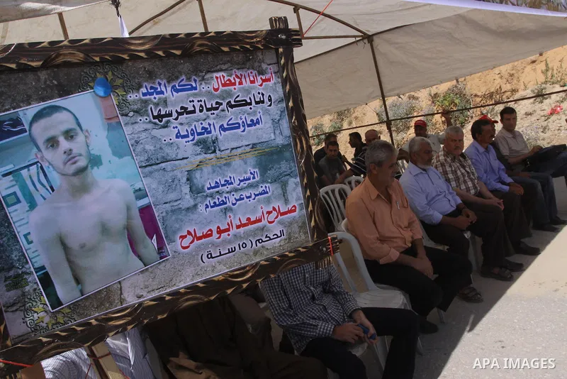 Palestinians take part a protest to solidarity with Palestinian prisoners, at a tent near Erez crossing in the northern Gaza Strip on June 01, 2014. It was about 120 Palestinians imprisoned without trial in Israel on an...