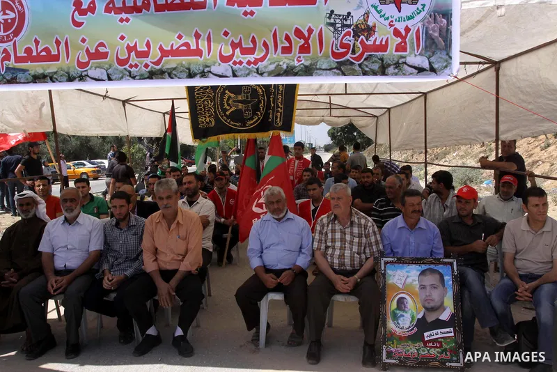 Palestinians take part a protest to solidarity with Palestinian prisoners, at a tent near Erez crossing in the northern Gaza Strip on June 01, 2014. It was about 120 Palestinians imprisoned without trial in Israel on an...