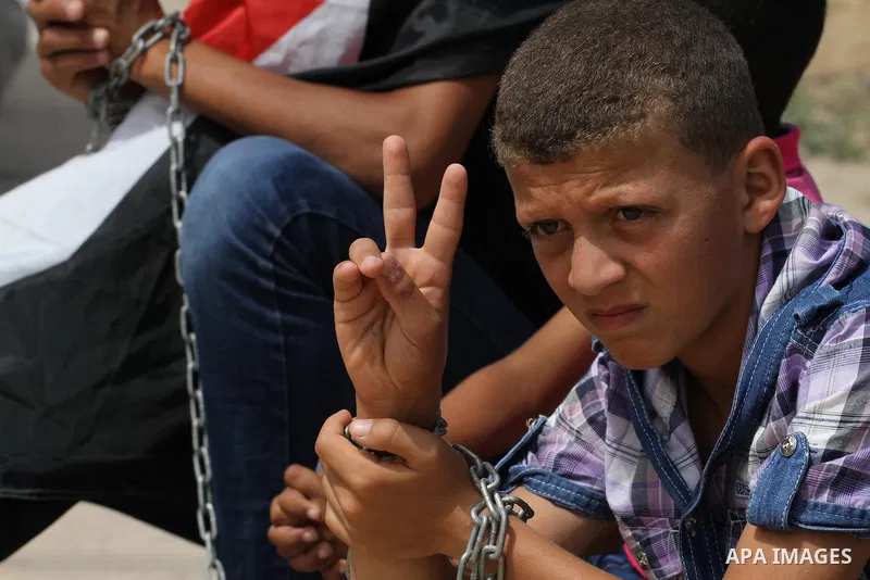 Palestinians take part a protest to solidarity with Palestinian prisoners, at a tent near Erez crossing in the northern Gaza Strip on June 01, 2014. It was about 120 Palestinians imprisoned without trial in Israel on an...