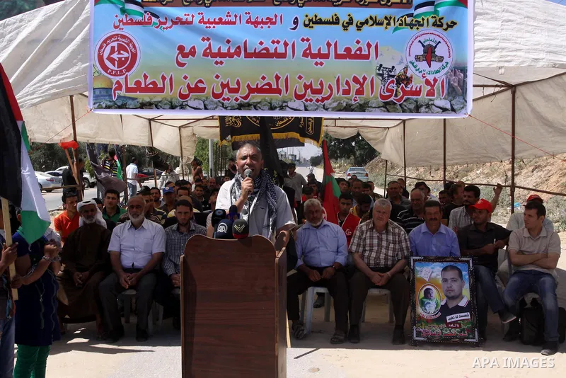 Palestinians take part a protest to solidarity with Palestinian prisoners, at a tent near Erez crossing in the northern Gaza Strip on June 01, 2014. It was about 120 Palestinians imprisoned without trial in Israel on an...