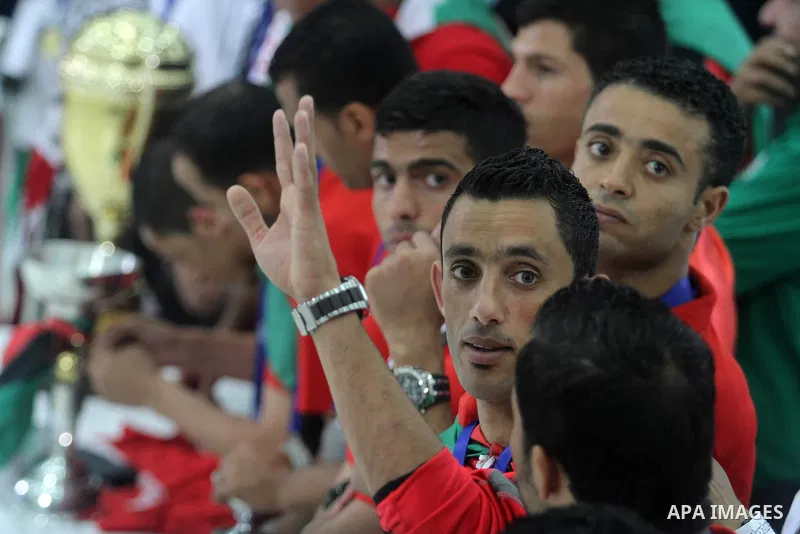 Members of Palestinian national football team arrive at Palestinian President Mahmoud Abbas's office after they won the AFC Challenge Cup, in the West Bank city of Ramallah on June 1, 2014. Palestine qualified for their...