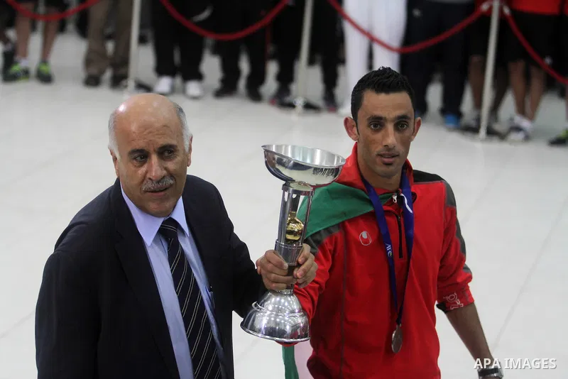 The President of the Palestinian Football Association, Jibril al-Rjoub, receives the Palestinian national football team which won the AFC Challenge Cup, at Palestinian President Mahmoud Abbas' office in the West Bank cit...
