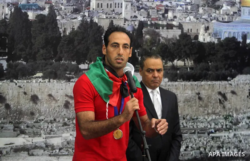Members of Palestinian national football team arrive at Palestinian President Mahmoud Abbas's office after they won the AFC Challenge Cup, in the West Bank city of Ramallah on June 1, 2014. Palestine qualified for their...