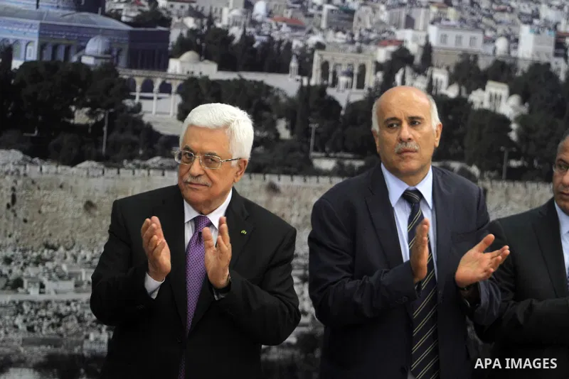 Palestinian President Mahmoud Abbas receives the Palestinian national football team which won the AFC Challenge Cup, at Abbas's office in the West Bank city of Ramallah on June 1, 2014. Palestine qualified for their maid...