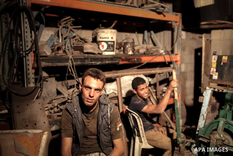 Palestinian workers drill water wells, in Gaza city, on June 01, 2014. The coastal aquifer, Gaza's main water source, has been continuously over-pumped for decades, even prior to Israel's occupation in 1967. Some 180 mil...