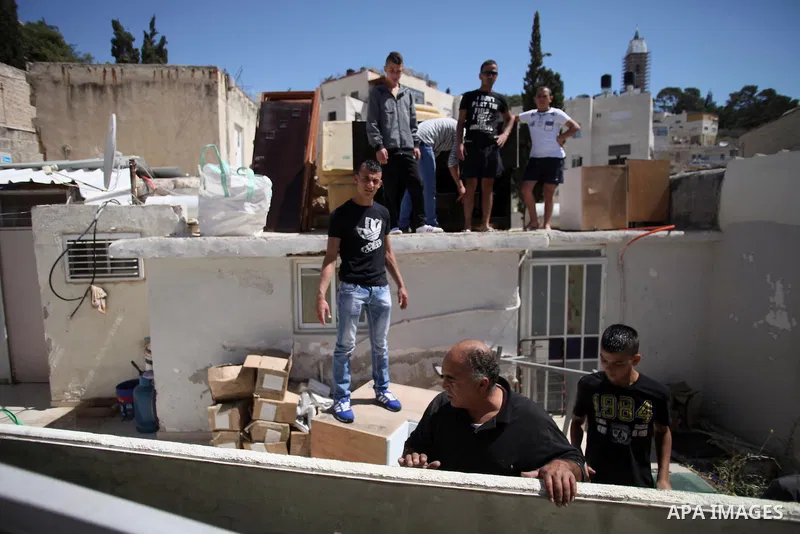 Palestinians inspect their belongings following demolished their sheds by Israeli bulldozers, in al-Tour neighborhood, east Jerusalem on June 02, 2014. Israel destroyed more than 500 Palestinian properties in the West Ba...