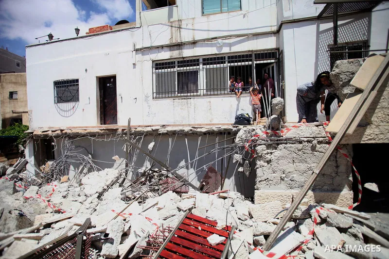 Palestinians inspect in the rubble of a store following demolished their sheds by Israeli bulldozers, in Ras al-Amud in Jerusalem on June 02, 2014. Israel destroyed more than 500 Palestinian properties in the West Bank a...