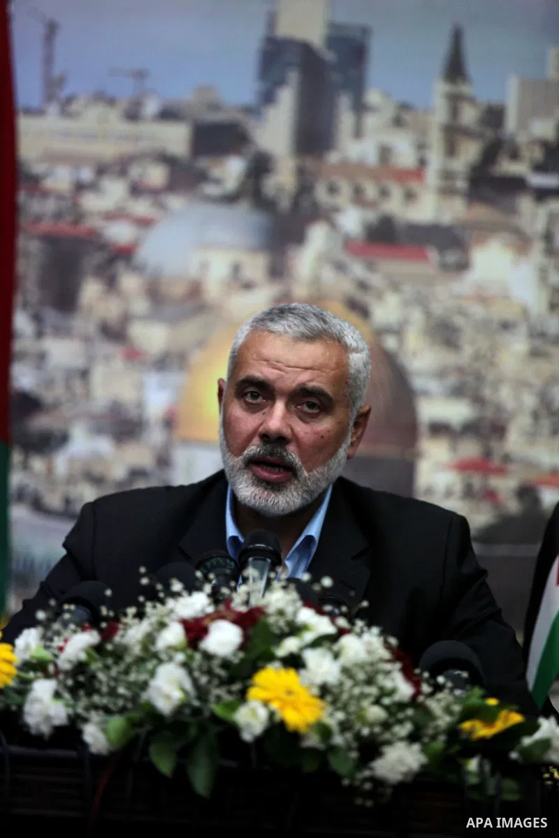 Senior Hamas leader Ismail Haniyeh speaks to media before leaving his office as a former Hamas government Prime Minister, in Gaza City June 2, 2014. President Mahmoud Abbas swore in a Palestinian unity government on Mond...