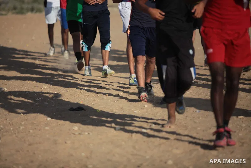 A photo taken on May 26, 2014, shows Palestinian football players exercise during a training, in Deir al-Balah in the central of Gaza Strip. Palestinians share a billion or more people around the globe the feeling of ant...