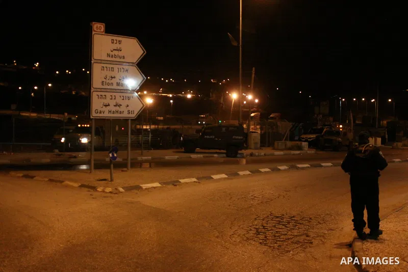 Israeli security forces stand guard at the Zaatara checkpoint after killed a Palestinian man, in the northern West Bank city of Nablus, on June 03, 2014. An Israeli army spokeswoman confirmed the incident, saying that a...