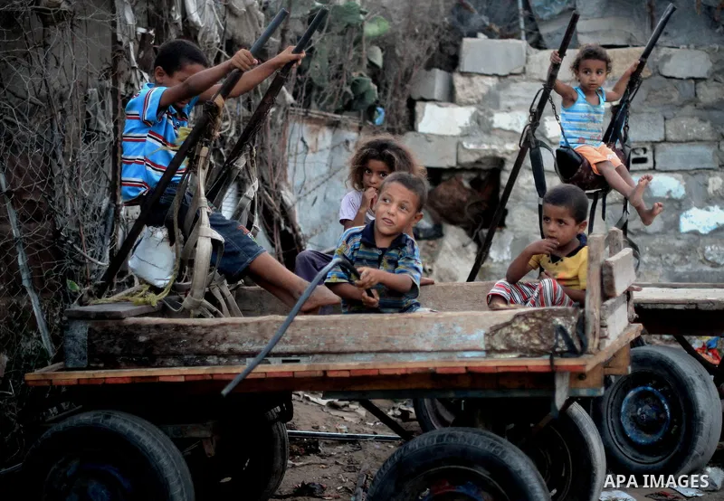 Palestinian children play outside their house at Al-Zaitoun neighborhood in the central Gaza Strip, on June 02, 2014. Photo by Ezz al-Zanoun