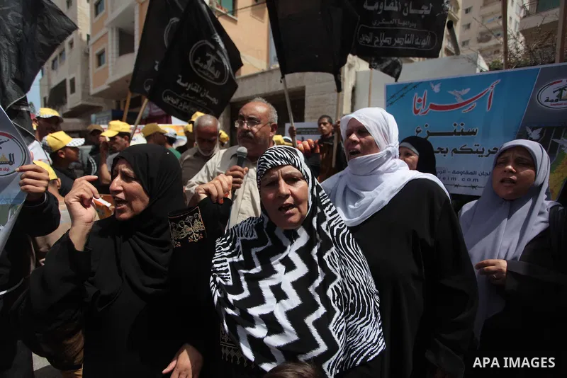 Palestinians take part a protest to solidarity with Palestinian prisoners held in Israeli jails, in front of Red cross office Gaza city, on June 03, 2014. It was about 120 Palestinians imprisoned without trial in Israel...