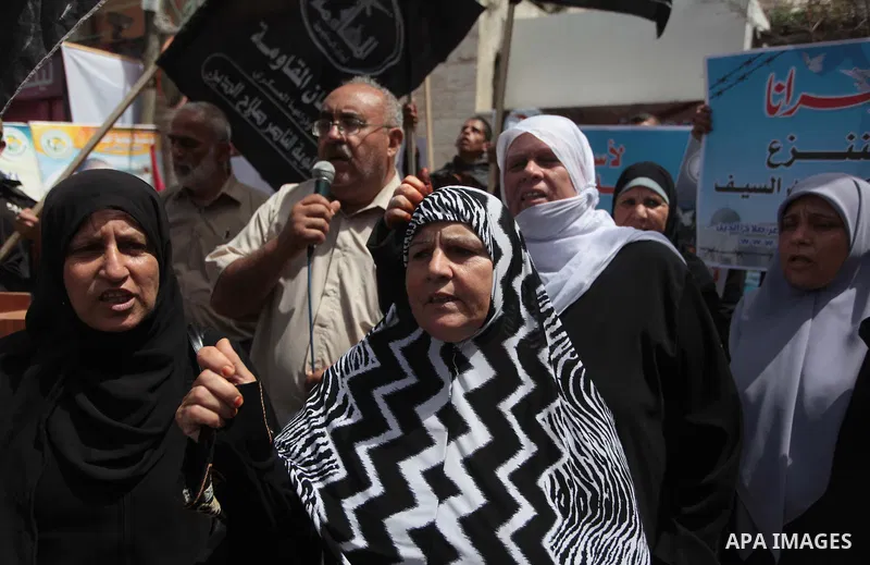 Palestinians take part a protest to solidarity with Palestinian prisoners held in Israeli jails, in front of Red cross office Gaza city, on June 03, 2014. It was about 120 Palestinians imprisoned without trial in Israel...
