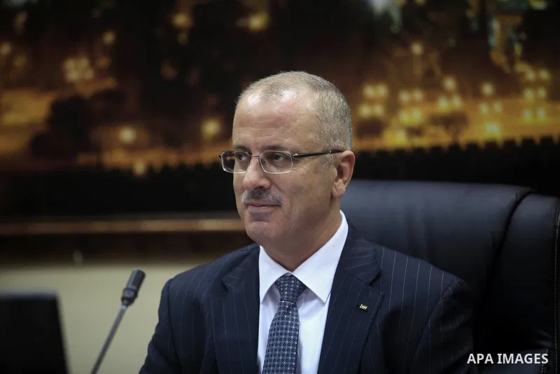 Prime Minister Rami Al-Hamdallah attends his first meeting of the new unity government cabinet, in the West Bank city of Ramallah, on June 3, 2014. The Palestinian national unity government was sworn in on Monday before...
