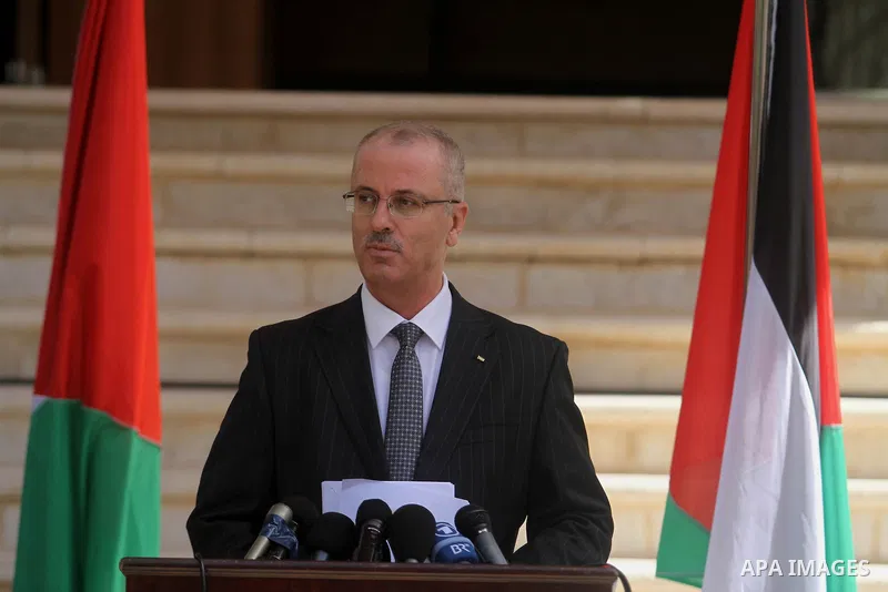 Palestinian Prime Minister Rami Hamdallah talks to media after the first unity government meeting in the West Bank city of Ramallah June 3, 2014. President Barack Obama's administration said on Monday it plans to work wi...