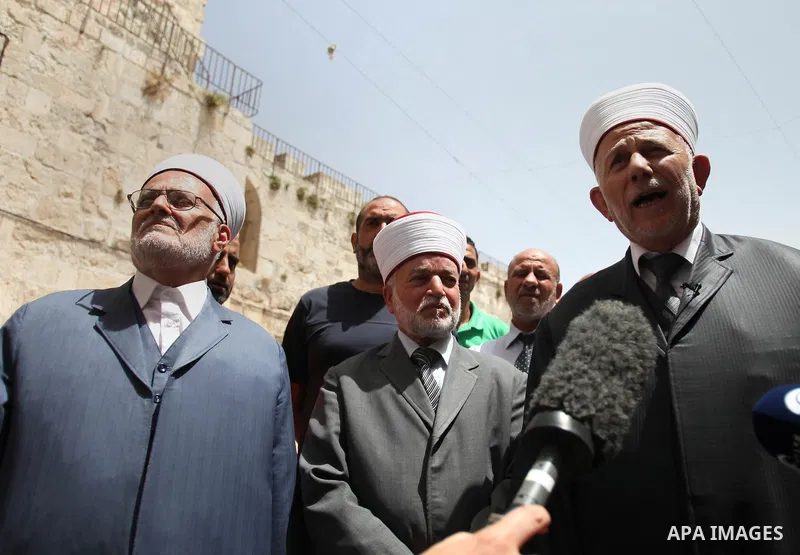 Palestinian members of Supreme Islamic Council hold a press conference, outside the al-Aqsa mosque compound, in Jerusalem's Old City on June 03, 2014. The Supreme Islamic Council represent the Israeli violations against...