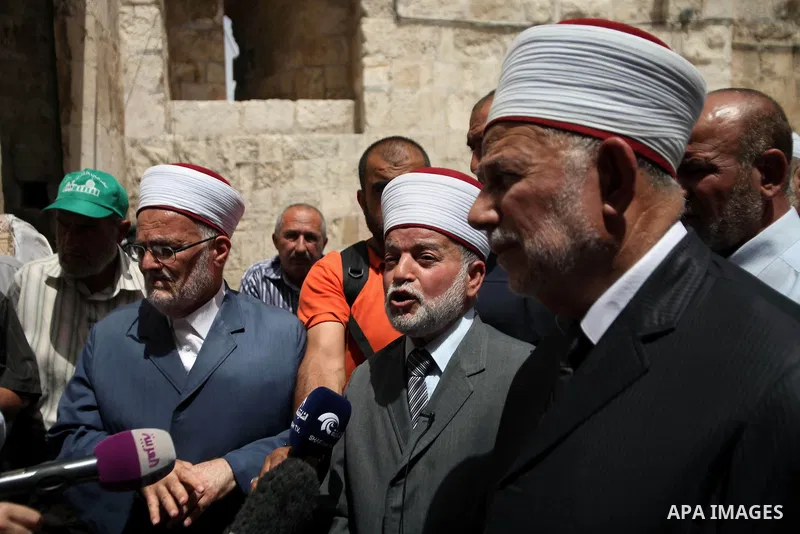 Palestinian members of Supreme Islamic Council hold a press conference, outside the al-Aqsa mosque compound, in Jerusalem's Old City on June 03, 2014. The Supreme Islamic Council represent the Israeli violations against...
