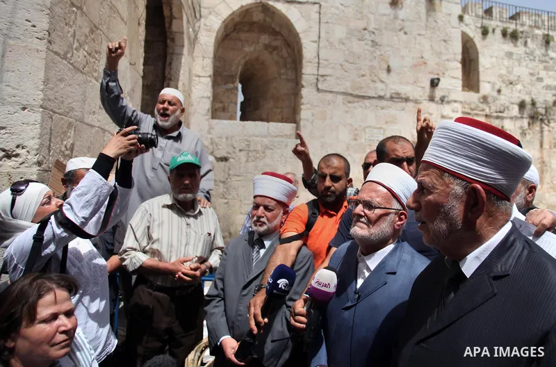 Palestinian members of Supreme Islamic Council hold a press conference, outside the al-Aqsa mosque compound, in Jerusalem's Old City on June 03, 2014. The Supreme Islamic Council represent the Israeli violations against...