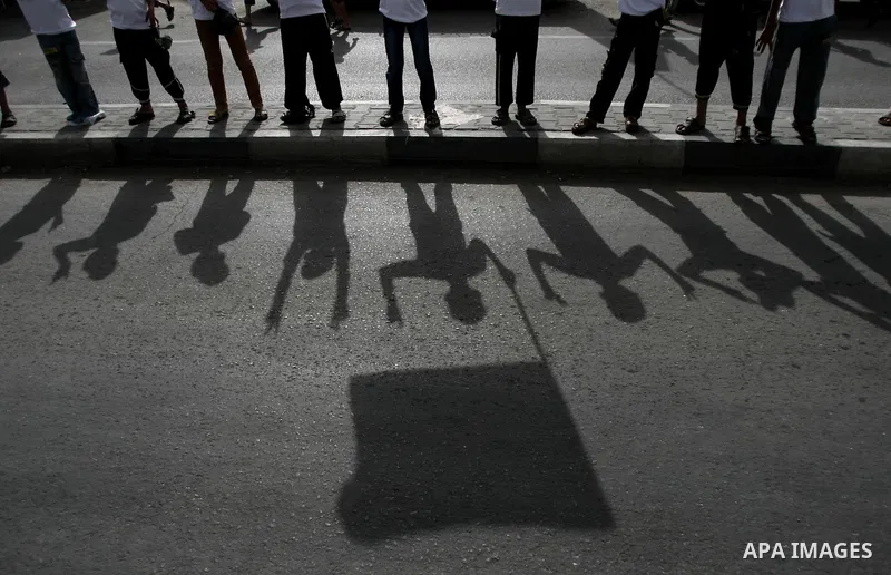 Palestinian children who participate in a summer camp organized by Hamas, parade the streets during a rally to show solidarity with Palestinian prisoners held in Israeli jails, in Rafah in the southern Gaza Strip, on Jun...