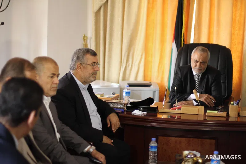 Palestinian Minister of Justice Salim Al Sakkaa attends his first meeting of the new unity government, in Gaza city, on June 04, 2014. The Palestinian national unity government was sworn in on Monday before Palestinian P...