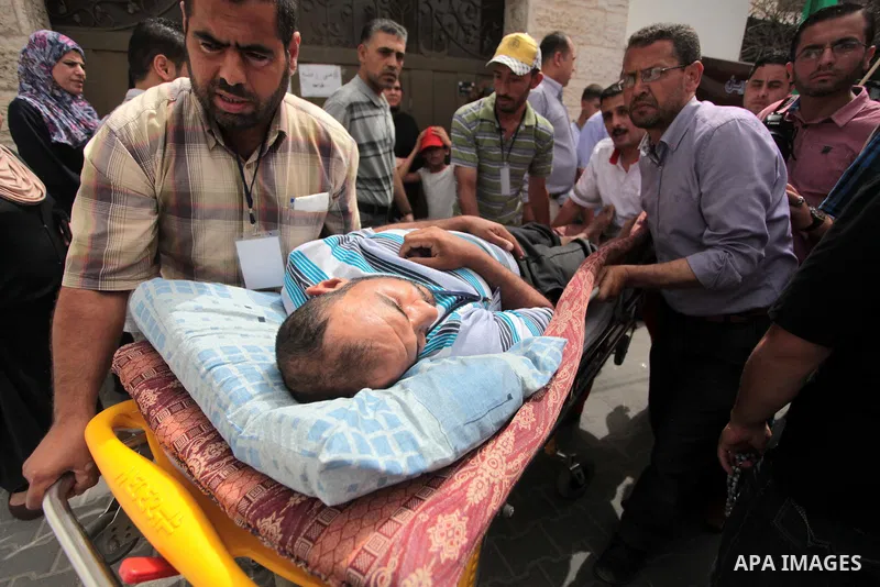 Palestinians take part a protest to solidarity with Palestinian prisoners held in Israeli jails, in Gaza city June 04, 2014. About 120 Palestinians imprisoned without trial in Israel on an open hunger strike, and only sa...