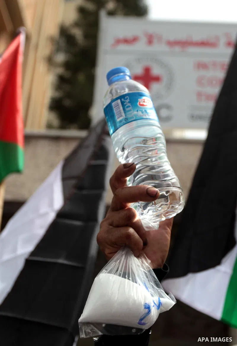 Palestinians take part a protest to solidarity with Palestinian prisoners held in Israeli jails, in Gaza city June 04, 2014. About 120 Palestinians imprisoned without trial in Israel on an open hunger strike, and only sa...