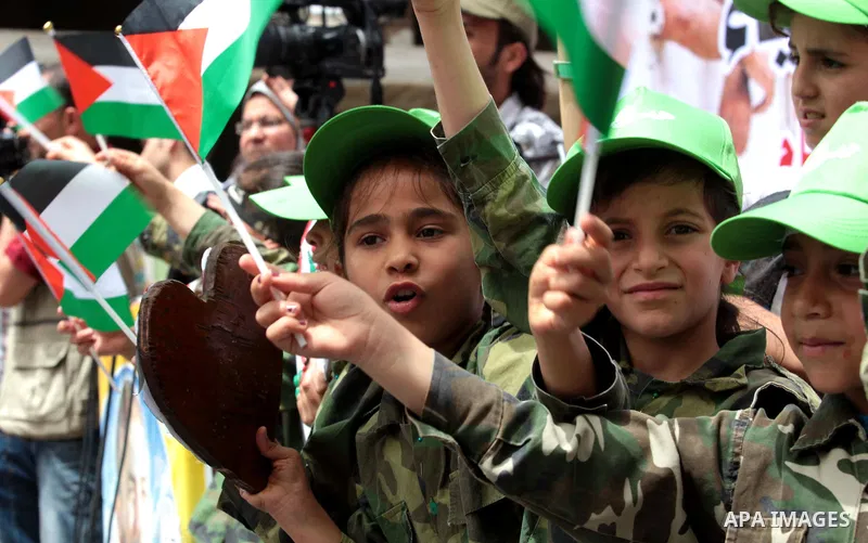 Palestinians take part a protest to solidarity with Palestinian prisoners held in Israeli jails, in Gaza city June 04, 2014. About 120 Palestinians imprisoned without trial in Israel on an open hunger strike, and only sa...