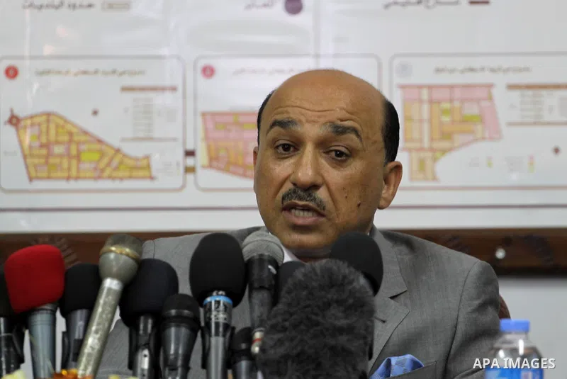 New Palestinian housing minister in the unity government Mufid al-Hasayneh speaks during a press conference after handed over his ministry's duties, in Gaza City on June 04, 2014. A long-awaited government of national un...