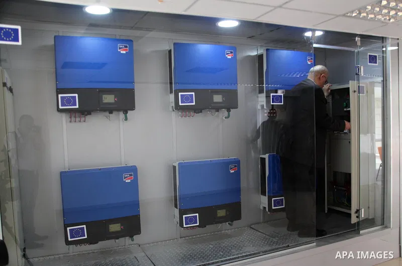Palestinian engineer Mohammed Tamimi inspects the control system of solar panels at al-Ahli hospital, in the West Bank City of Hebron, June May 04, 2014. Al-Ahli Hospital Wind Energy Project (AWEP) funded by European Uni...