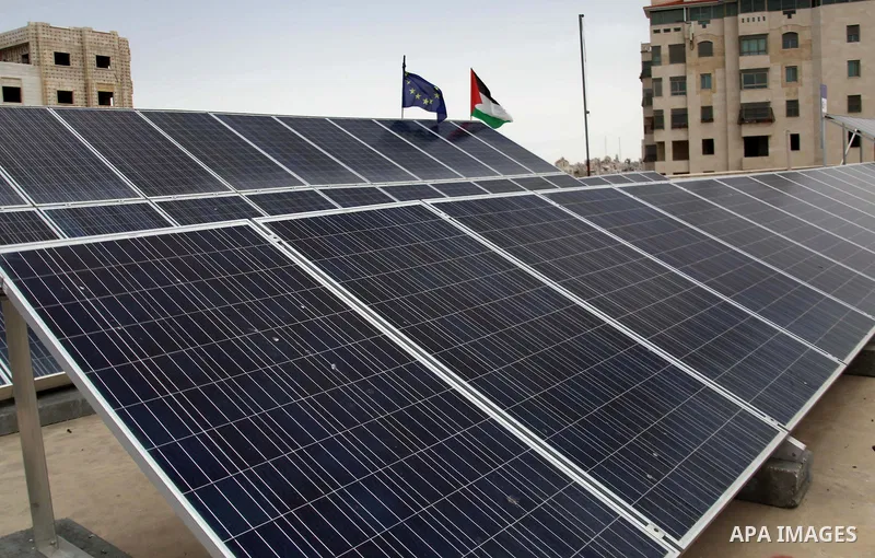 Palestine and European Union flags are seen on solar panels at al-Ahli hospital, in the West Bank City of Hebron, June May 04, 2014. Al-Ahli Hospital Wind Energy Project (AWEP) funded by European Union, is an innovative...