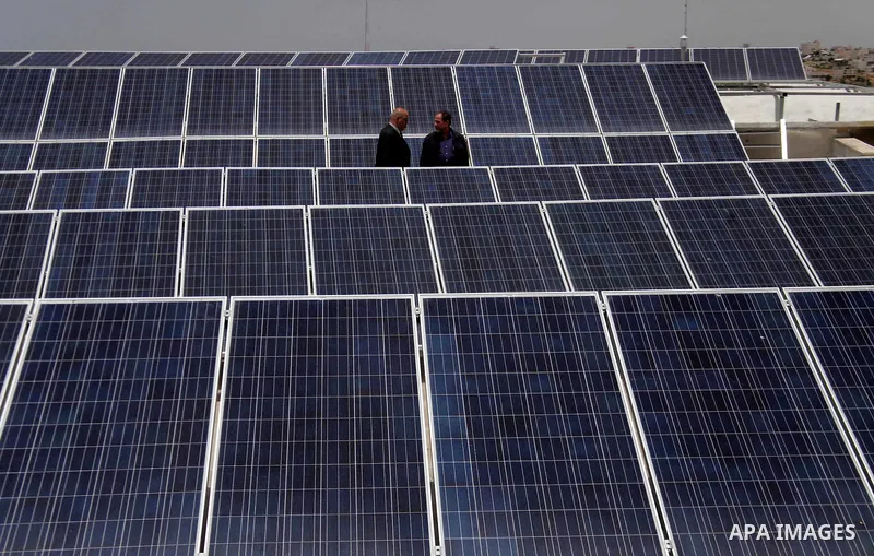 Palestinian engineer Mohammed Tamimi inspects solar panels, at al-Ahli hospital in the West Bank City of Hebron, June May 04, 2014. Al-Ahli Hospital Wind Energy Project (AWEP) funded by European Union, is an innovative p...