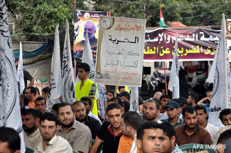 Palestinian supporters of al-Ahrar party take part a protest in the support of the prisoners who are on hunger strike, outside Red Cross Office, in Gaza city June 04, 2014. About 120 Palestinians imprisoned without trial...
