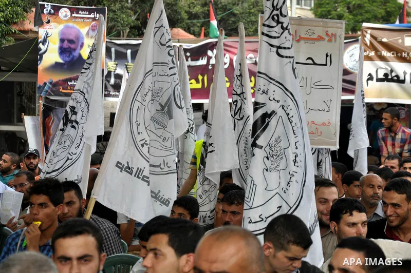 Palestinian supporters of al-Ahrar party take part a protest in the support of the prisoners who are on hunger strike, outside Red Cross Office, in Gaza city June 04, 2014. About 120 Palestinians imprisoned without trial...