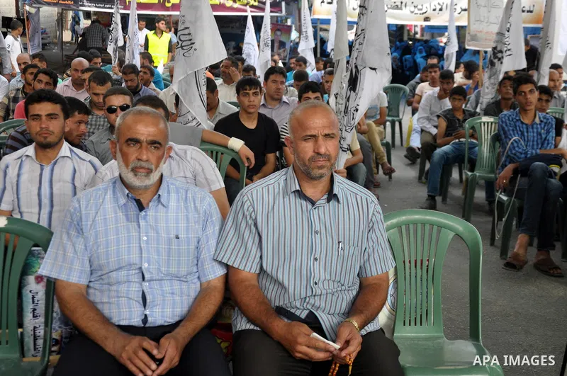 Palestinian supporters of al-Ahrar party take part a protest in the support of the prisoners who are on hunger strike, outside Red Cross Office, in Gaza city June 04, 2014. About 120 Palestinians imprisoned without trial...